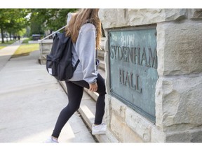 A student enters the Medway-Sydenham Hall residence at Western University in London, Ont. Reports have emerged that several female students in the residence were drugged and sexually assaulted last weekend.