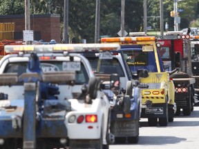 An August 2015 file photo of tow trucks in Ottawa.