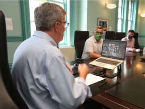 Ottawa Mayor Jim Watson, left, held a virtual meeting at the chief of police, Peter Sloly, on Wednesday following recent incidents of violence across the city.