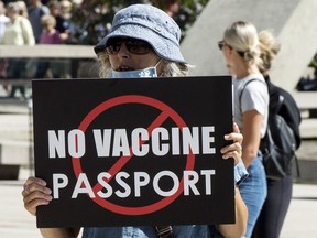 FILE: People protest the implementation of the vaccine passport in Toronto.