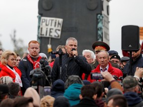 Participants, including members and supporters of the Russian Communist Party, attend an opposition rally to protest against the results of a parliamentary election in Moscow, Russia on Saturday.