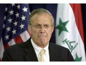 Then-U.S. secretary of defense Donald Rumsfeld gives a news conference at the Pentagon in 2004 on the status of Iraq.