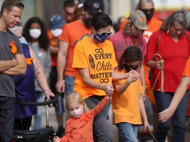 Many attendees wore orange at a powwow in Winnipeg on the National Day of Truth and Reconciliation.