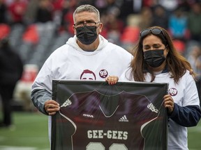 Michel Perron and Annie Simard, parents of Francis Perron, who passed away on Sept. 18, were at Saturday's Panda Game to participate in a pre-game tribute to their son.