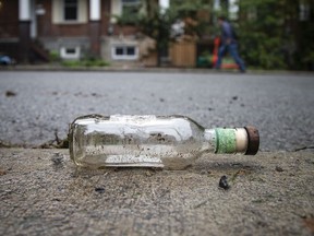 A photo shows a beer bottle left laying on Russell Avenue on the day after the Oct. 2 street party.