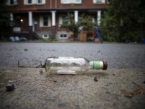 A beer bottle on Russell Avenue on the day after the late-night post-Panda Game party on Russell Avenue.
