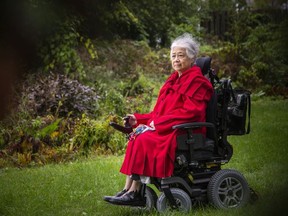 Elizabeth Hung Sorfleet, pictured outside her Ottawa home, is concerned about the enforcement of the city's mask mandates  on Para Transpo buses.
