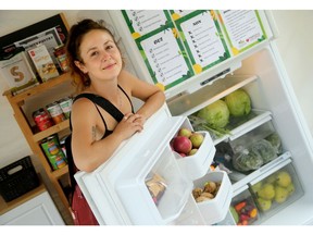 July, 2021: Parkdale Food Centre employee Alexia Smith shows what's inside the new Community Fridge and Pantry.
