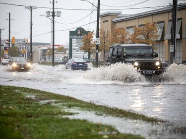 OTTAWA -- October 16, 2021 -- Ottawa was hit with heavy rainfall Saturday, October 16, 2021, that result in flooding on many area streets. Some vehicles chose alternate routes, but some ventured through a large, very deep puddle on Industrial Ave near the Train Yards Saturday morning. 

ASHLEY FRASER, POSTMEDIA