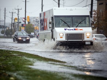 OTTAWA -- October 16, 2021 -- Ottawa was hit with heavy rainfall Saturday, October 16, 2021, that result in flooding on many area streets. Some vehicles chose alternate routes, but some ventured through a large, very deep puddle on Industrial Ave near the Train Yards Saturday morning. 

ASHLEY FRASER, POSTMEDIA