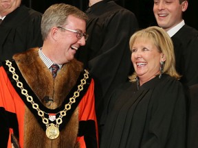Ottawa Mayor Jim Watson shares a laugh with Coun. Diane Deans prior to be being sworn in after the 2014 election. Could she be the next mayor?
