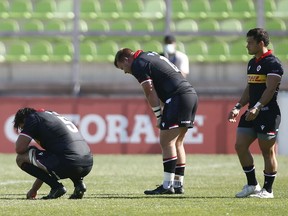 Canadian players react after losing during a match between Chile and Canada as part of Rugby World Cup 2023 Qualifying at Elias Figueroa Brander Stadium on October 9, 2021 in Valparaiso, Chile.