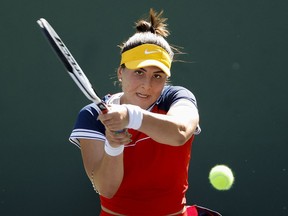 Bianca Andreescu of Canada returns a shot to Anett Kontaveit of Estonia during the BNP Paribas Open at the Indian Wells Tennis Garden on October 11, 2021 in Indian Wells, California.