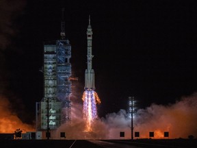 The Shenzhou-13 carried by a Long March-2F rocket launches with three astronauts from China Manned Space Agency on board early on October 16, 2021 from the Jiuquan Satellite Launch Center in the Gobi Desert near Jiuquan, China.