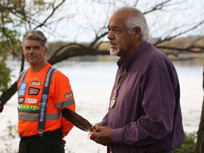 "Groomer Dave" Adams, left, listens as Algonquin elder Albert Dumont speaks during Thursday's ceremony to officially rename the SJAM Winter Trail as the Kichi Sibi Winter Trail.