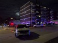 Several Ottawa police vehicles near 131 Parkdale Ave., where an investigation into a double shooting continues on Wednesday, Oct. 20, 2021.