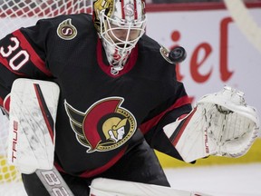 Ottawa Senators goaltender Matt Murray (30) makes a save against the San Jose Sharks during second period NHL action at the Canadian Tire Centre on October 21,2021.