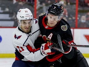 Ottawa Senators left wing Brady Tkachuk (7) battles with Washington Capitals right wing Garnet Hathaway (21) during first period NHL action at the Canadian Tire Centre on October 25,2021.