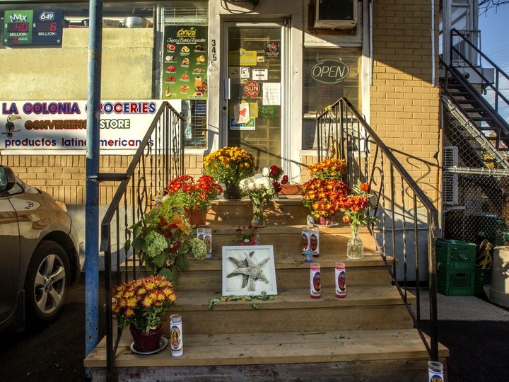  Friends and customers have left flowers, candles and messages on the front steps of La Colonia Groceries in Vanier, after owners Fred and Marta Martinez died of COVID-19 on Oct. 8.