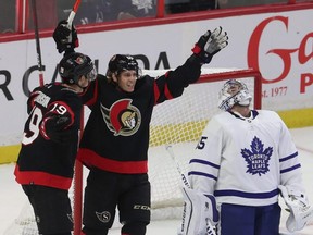 Ottawa Senators’ Drake Batherson helps celebrate Tyler Ennis’ first-period goal against Leafs goalie Petr Mrazek in October, 2021