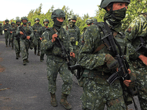 Soldiers march during the annual Han Kuang anti-invasion drill in Tainan, Taiwan, September 14, 2021.