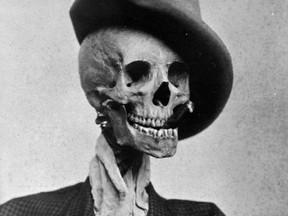 From a series of 1910 novelty photos by the Canadian amateur photographer John Boyd. Those are real human bones he dressed up, if you're wondering.