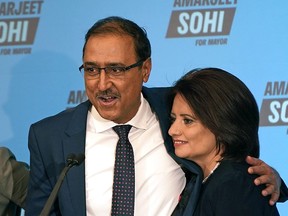 Edmonton Mayor-Elect Amarjeet Sohi gives his victory speech,  with his wife Sarbjeet at his side, at the Matrix Hotel in Edmonton after being declared the winner in Edmonton's municipal election on October 18, 2021, making history as the first person of colour to hold that position.