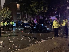 A car was flipped by revellers at a post-Panda street party on Russell Avenue, Oct. 2, 2021. Some residents said the vehicle was flipped multiple times.