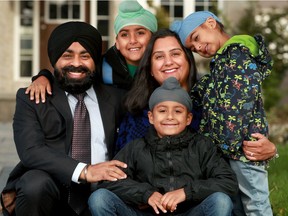 Parents Harpreet Singh (left) and Sarbjit Sondha are trying to make the best of having all three of their boys (Nihaal, 9, Akaal, 6 and Dayaal, 4) home from school following a COVID outbreak at St. Benedict school, but it's been disruptive.