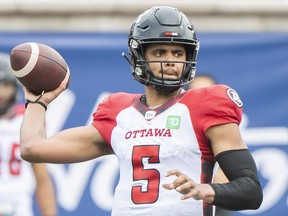 Ottawa Redblacks quarterback Caleb Evans throws a pass during first half CFL football action against the Montreal Alouettes in Montreal, Monday, October 11, 2021.