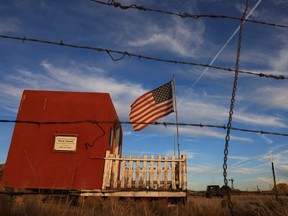 The entrance to the film set of "Rust" is seen through a barbed wire fence after Hollywood actor Alec Baldwin fatally shot a cinematographer and wounded a director when he discharged a prop gun on the movie set in Santa Fe, New Mexico, U.S., October 22, 2021.