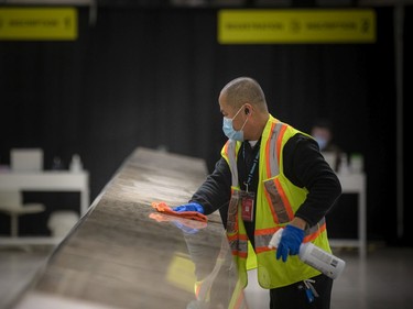 The first international flight since the pandemic began, a flight from Fort Lauderdale, Fla., landed at the Ottawa International Airport on Sunday, Oct. 31, 2021. Staff were cleaning the arrival area prior to travellers coming through.