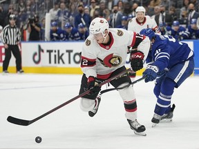 Ottawa Senators forward Shane Pinto (12) picks up a rebound against the Toronto Maple Leafs during the second period at Scotiabank Arena.