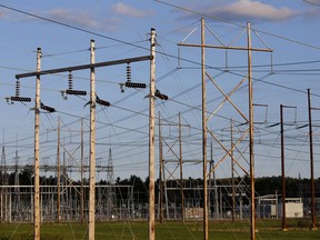 In this 2019 photo, power lines power lines converge on a Central Maine Power substation in Pownal, Maine. The company's controversial 145-mile, billion-dollar power line would bring hydro-electricity from Canada into the regional grid, to serve Massachusetts customers.