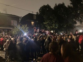 A handout of a photo of partiers on Russell Avenue last Saturday night.