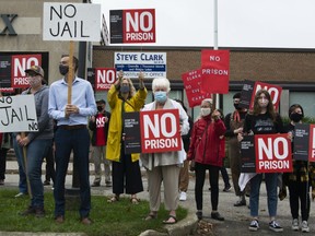 A file photo from mid-October shows protesters rally against the proposed prison set to be built in Kemptville outside the constituency office of MPP Steve Clark in Brockville.
