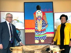 Dr. Bernard Leduc and Allison Fisher with painting from Mohawk artist Lee Claremont titled "New Beginnings" which will be placed with pride in Montfort's Family Birthing Centre.