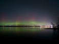 Northern Lights over the Ottawa River and Gatineau. The Champlain Bridge can be seen on the right all lit up.