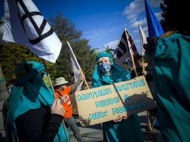 A group gathered in Gatineau at the Maurice Richard statue before marching through Ottawa's downtown core on Saturday as part of the Global Day of Action for Climate Justice.