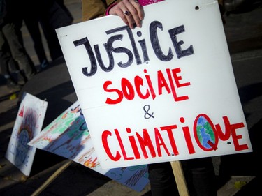 A group gathered in Gatineau at the Maurice Richard statue before marching through Ottawa's downtown core on Saturday as part of the Global Day of Action for Climate Justice.