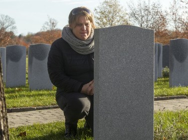 Annie Bourbonnais visiting the Beechwood Cemetery grave of her husband, Dan Labelle.