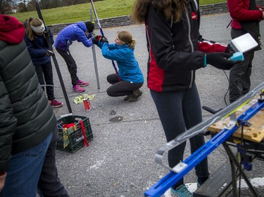 A group of volunteers, Nepean High School students and parents gathered in the Remic Rapids Park parking lot to clean up and wax donated cross-country skis that will be for the Kichi Sibi Winter Trail's Skis for Schools program, Sunday, November 14, 2021.