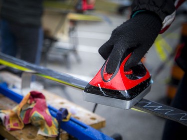 A group of volunteers, Nepean High School students and parents gathered in the Remic Rapids Park parking lot to clean up and wax donated cross-country skis that will be for the Kichi Sibi Winter Trail's Skis for Schools program, Sunday, November 14, 2021.