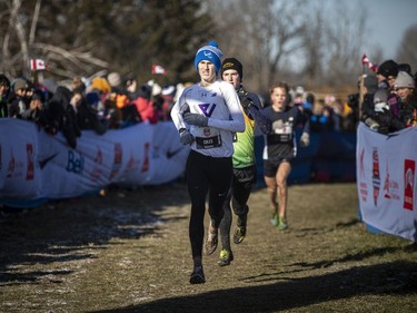 Tristan Coles of St. Thomas, Ont, finishes fourth in the under-18 men's race with a time of 20:12 for six kilometres. His twin brother, Aiden Coles, was the race winner in 19:49.
