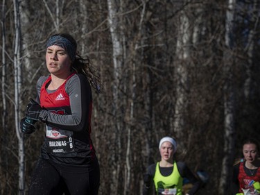 Ivy Bialowas of Ottawa makes her way through a portion of the trail in the woods during the under-20 women's six-kilometre race. She would place eighth.