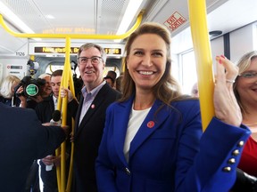 Once upon a time, they got along: Jim Watson and Caroline Mulroney (foreground) enjoy the launch of the LRT Confederation Line, Sept. 14, 2019.