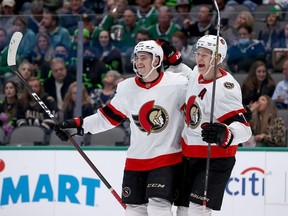 Ottawa Senators Drake Batherson (left) and Brady Tkachuk (right) celebrate after Josh Norris (not shown) scored against the Dallas Stars in the second period at American Airlines Center on October 29, 2021 in Dallas, Texas.