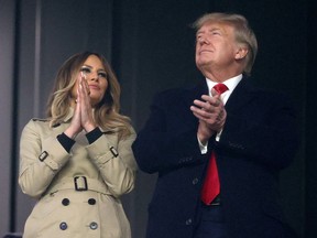 Former first lady and president of the United States Melania and Donald Trump look on during Game Four of the World Series between the Houston Astros and the Atlanta Braves.