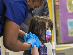 Indiana Chang, 5, is administered the coronavirus (COVID-19) vaccine on November 08, 2021 in the Lower East Side in New York City.