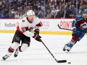 Connor Brown (#28) of the Ottawa Senators advances the puck against the Colorado Avalanche in the first period at Ball Arena on November 22, 2021 in Denver, Colorado.